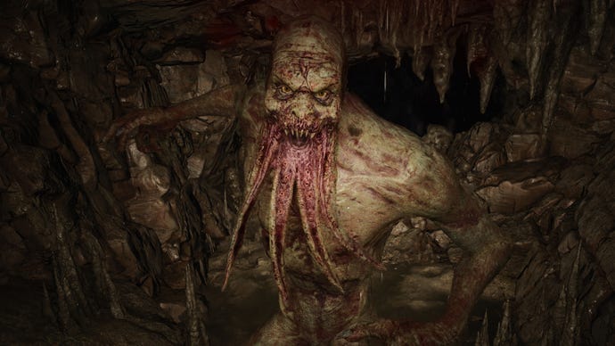 A close-up of a Bloodsucker mutant in Stalker 2 attack the player inside a cave.