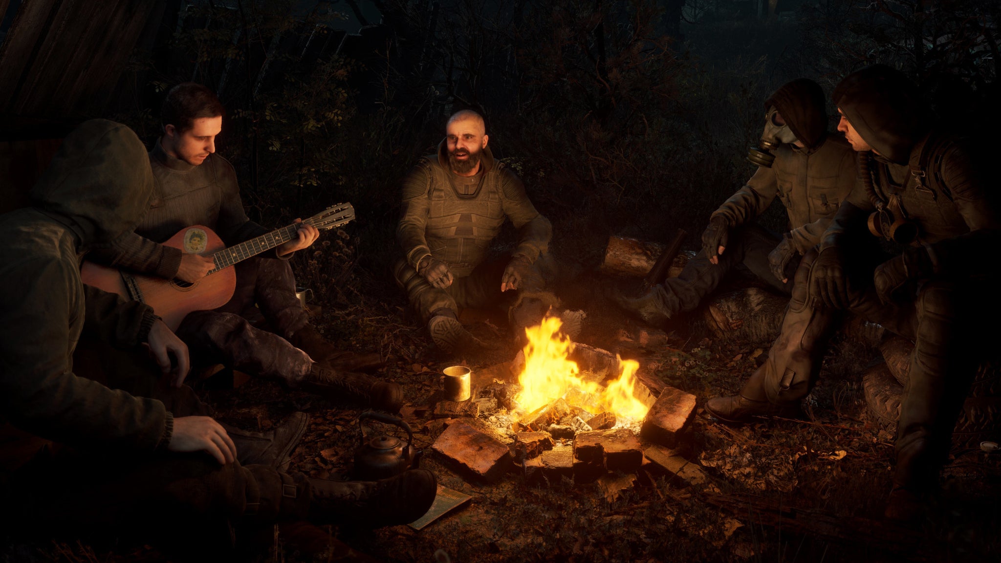 Scavengers gathered round a campfire in a S.T.A.L.K.E.R. 2 screenshot. - 26