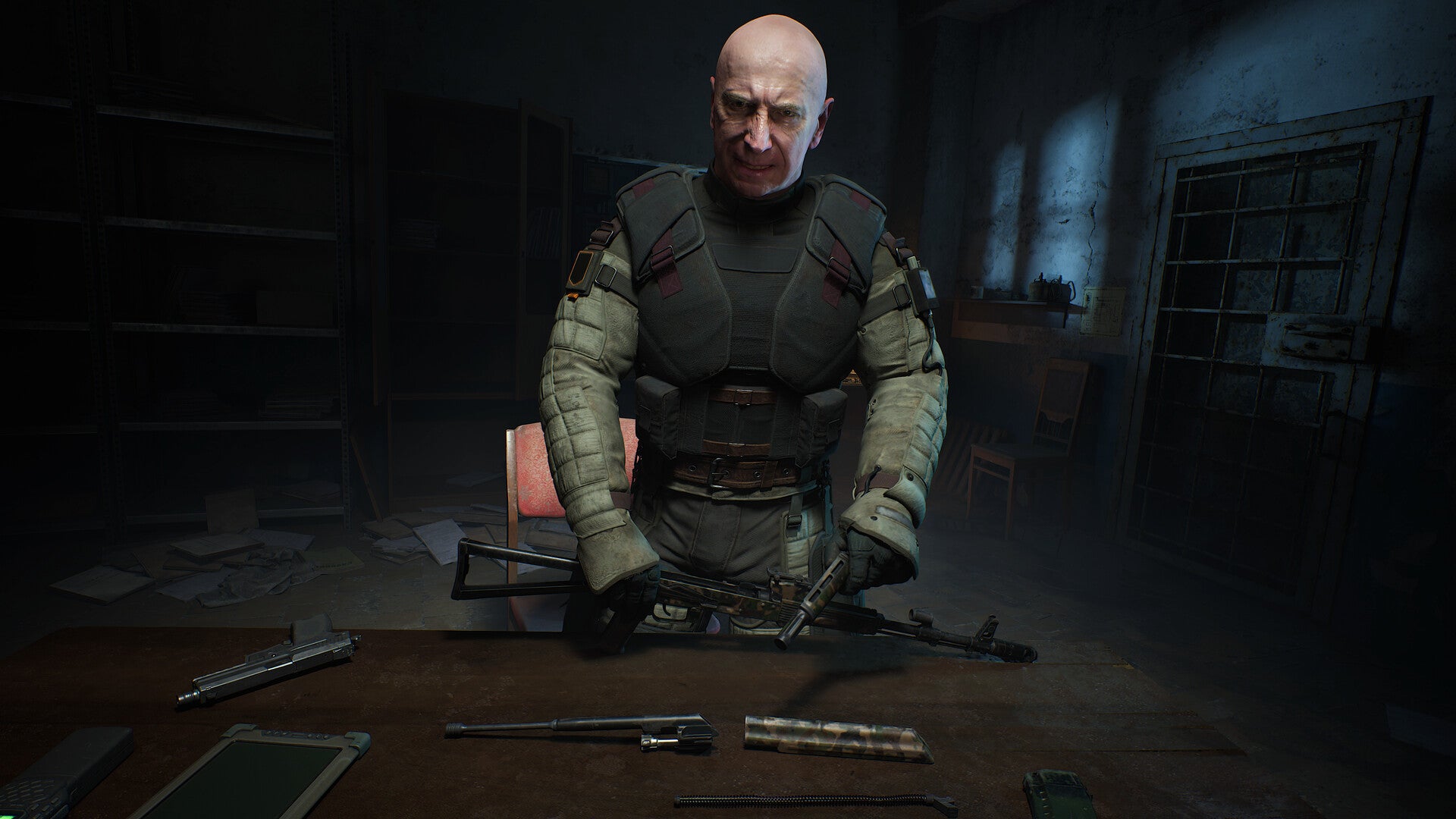 A close-up of Colonel Korshunov, a key character in Stalker 2, bending over a table in a darkened room and looking at the player camera. - 8