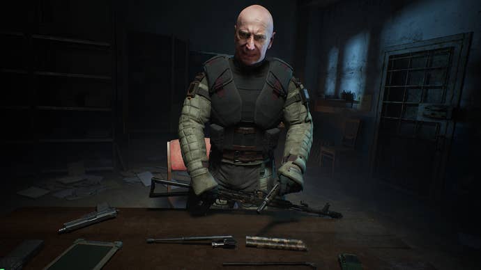 A close-up of Colonel Korshunov, a key character in Stalker 2, bending over a table in a darkened room and looking at the player camera.