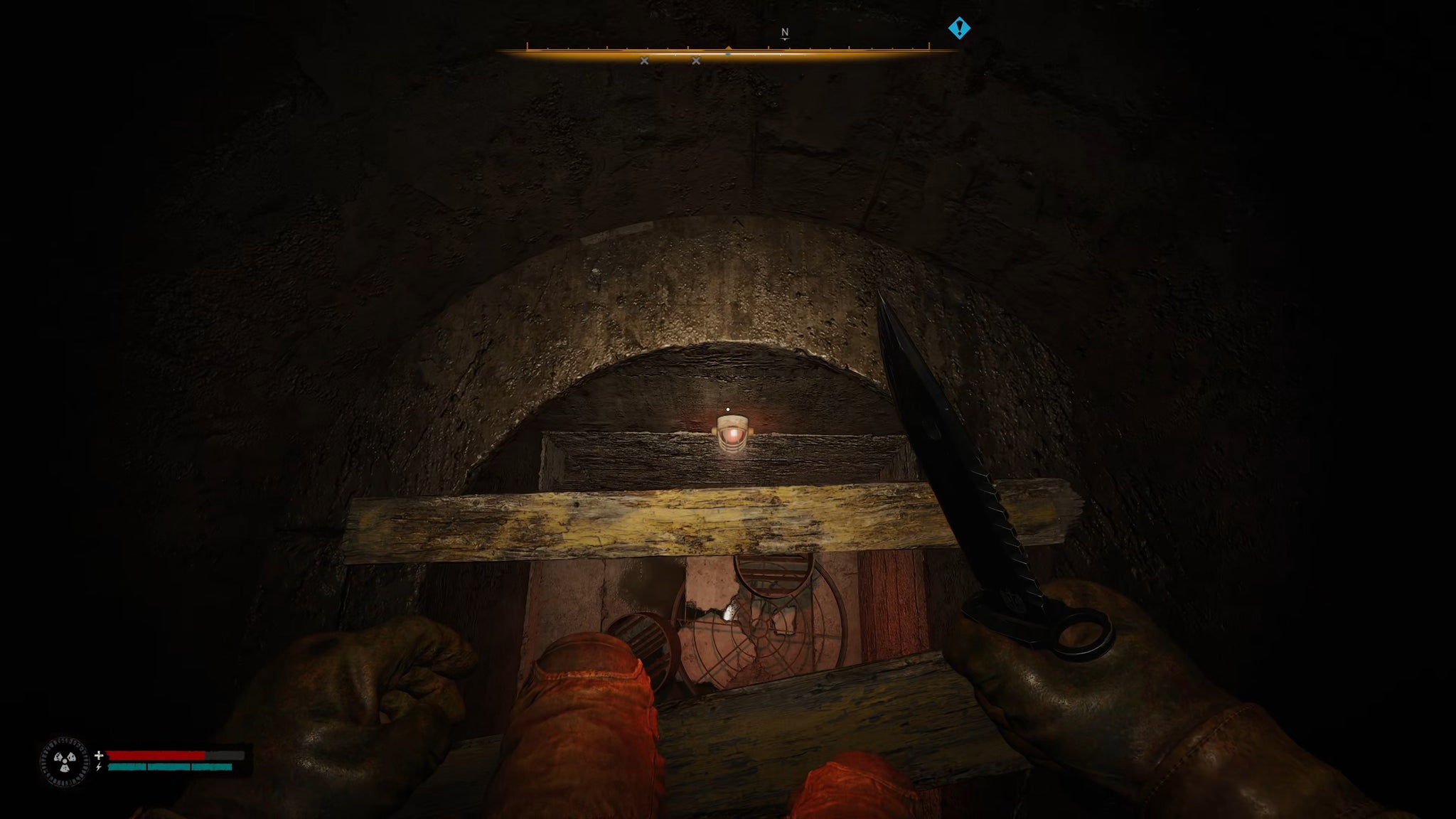 The player in Stalker 2 looks down inside a vertical tunnel drop and prepares to slash with their knife at the wooden planks beneath their feet. - 5
