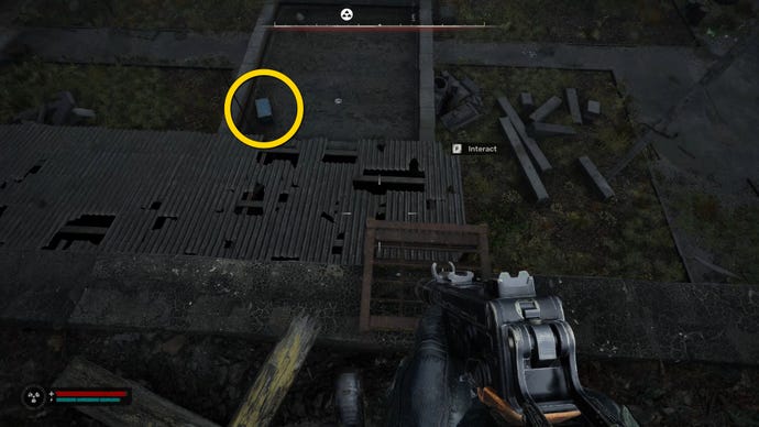 The player in Stalker 2 approaches a blue chest on a roof.