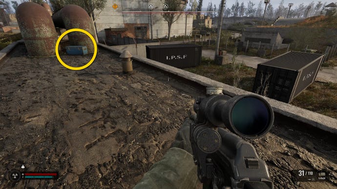 The player in Stalker 2 approaches a blue chest atop a roof.