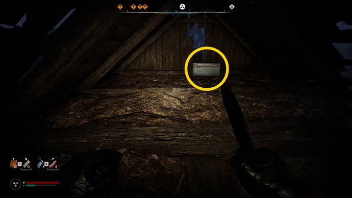 The player in Stalker 2 approaches a blue chest in an attic.