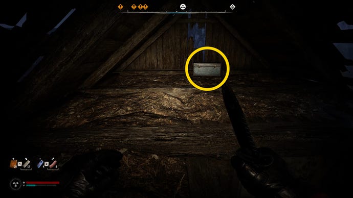The player in Stalker 2 approaches a blue chest in an attic.