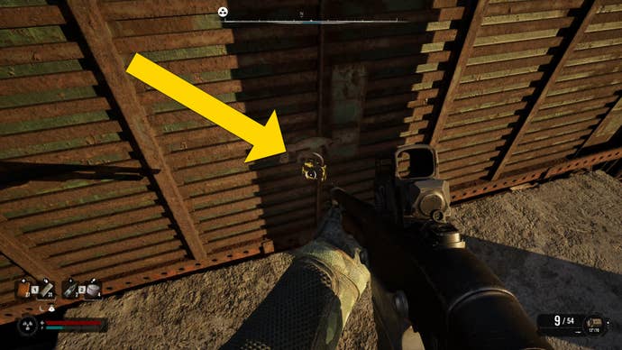 The player in Stalker 2 looks at a padlock on the door of a train carriage.