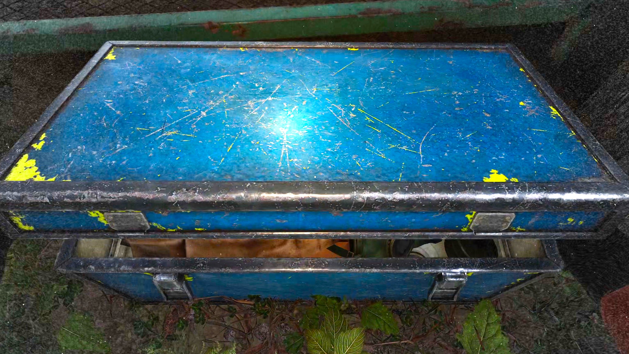 A close-up of a bright blue chest, partially open, in Stalker 2. - 1
