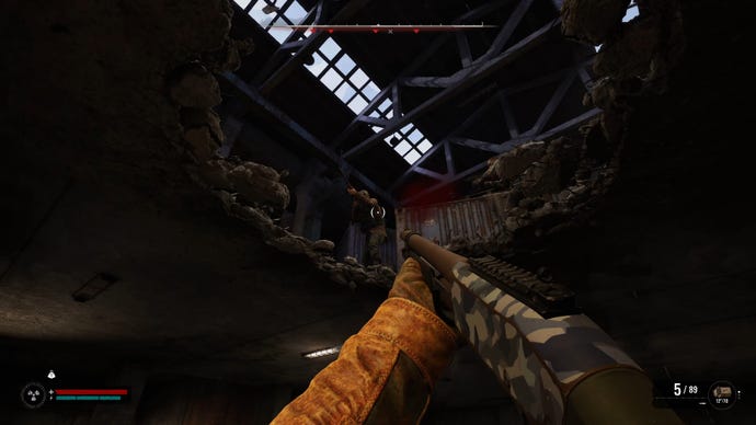 The player in Stalker 2 aims and shoots their shotgun up through a hole in the ceiling at an enemy.