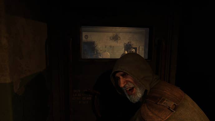 A close-up of Scar, a character in Stalker 2, laughing from behind a door with a small window, through which a team of enemy soldiers can be seen.