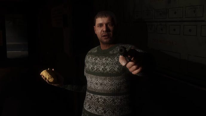 Solder, a character in Stalker 2, points a gun at the player in a darkened room.