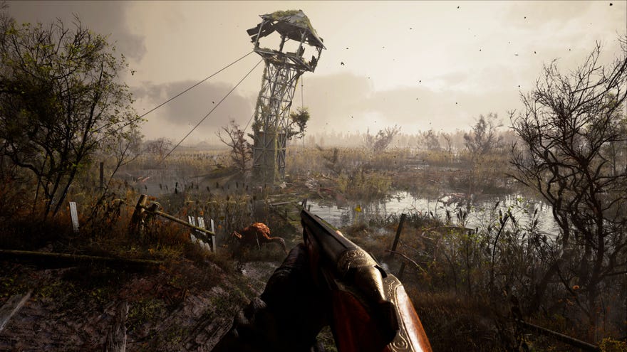The player in Stalker 2 stands in front of a leaning tower in the Swamp.