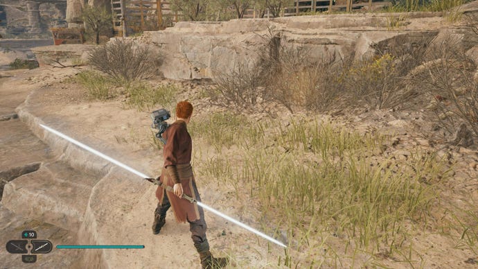 Cal prepares to cut down a glowing plant in Jedi: Survivor with his double-bladed lightsaber.