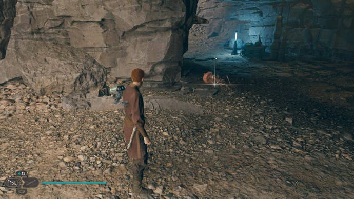 Cal approaches the corpse of a Scavenger Droid outside a cave in Jedi: Survivor.