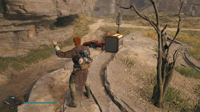 Cal stands in front of a red chest in the Untamed Downs in Jedi: Survivor.