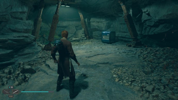 Cal approaches a chest in an indoor cave-like area in Jedi: Survivor.