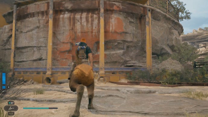 Cal sits on a Nekko in front of a ledge, at the top of which is another Star Wars Jedi: Survivor perk slot essence.