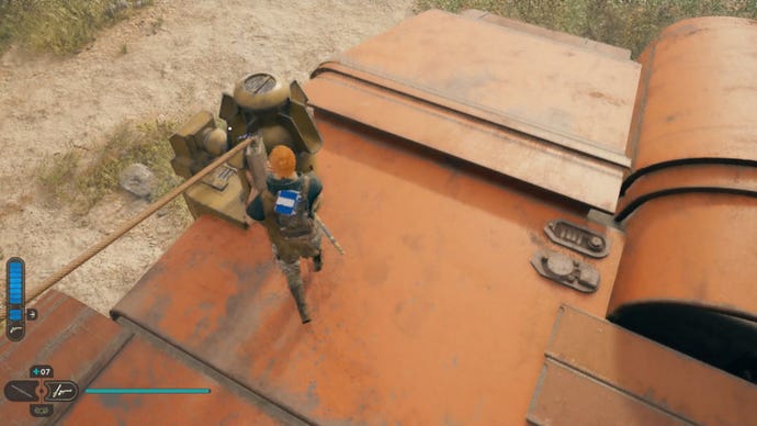 Cal affixes a cord to an apparatus as part of the Star Wars Jedi: Survivor Rambler’s Reach rooftop puzzle solution.