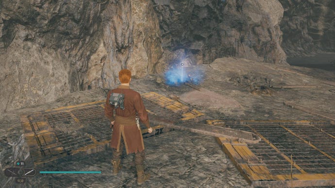 Cal approaches and picks up a collectible on Koboh in Jedi: Survivor.