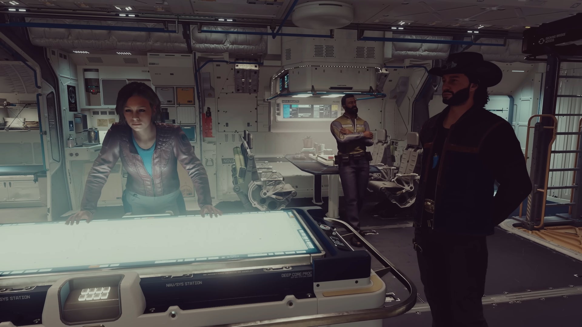 Sarah Morgan and Sam Coe stand around a table on the player&rsquo;s ship in Starfield.