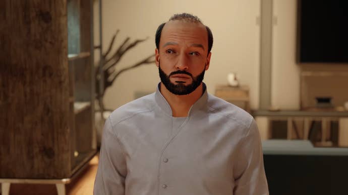 The player character’s dad stands in his home in front of the camera in Starfield.