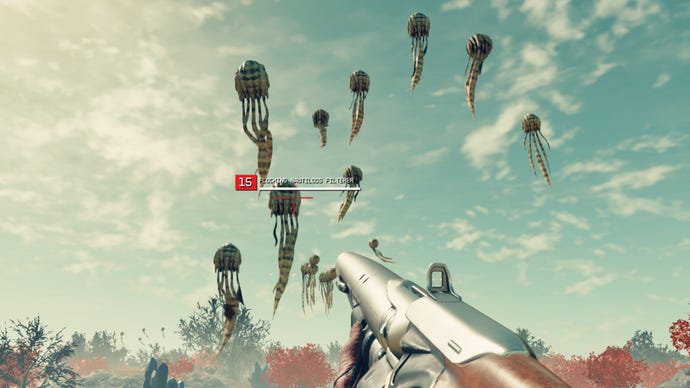 The player in Starfield aims their gun at a cluster of Flocking Nautiloos Filterers floating through the air on an alien planet.