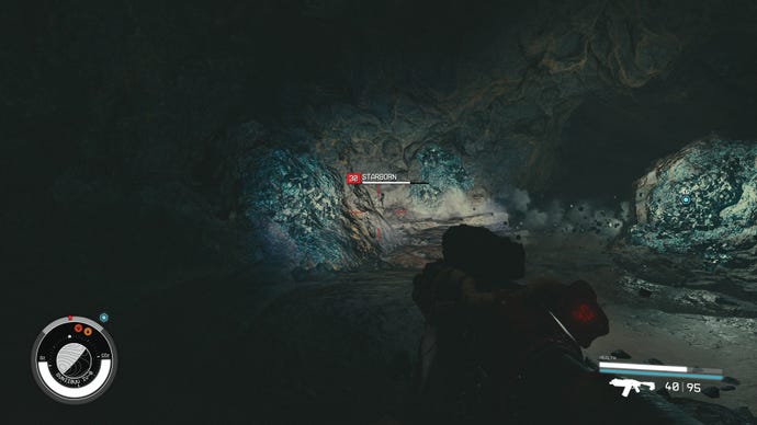 A Starborn appears in front of artifact Theta in Starfield.