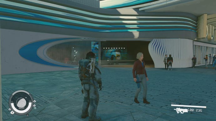 The player character and Sarah Morgan stand outside a Genetics Facility in New Atlantis in Starfield.