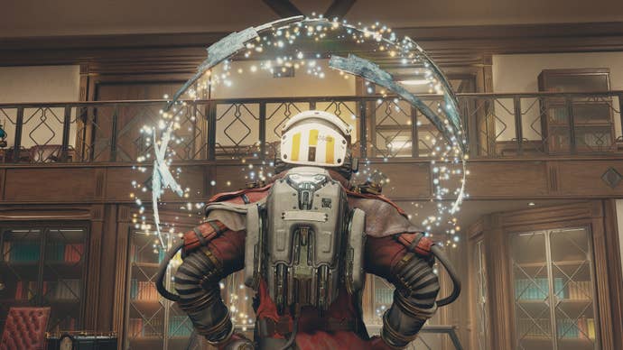 The player in Starfield stands with their back to the camera looking at the sphere of artifact in the Lodge.