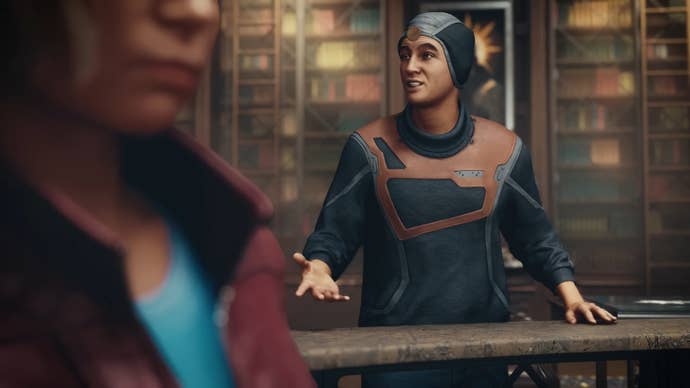 Matteo speaks to someone off-camera in Constellation HQ in Starfield.