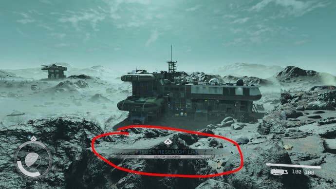 The rocky landscape of Kreet in Starfield with a Research Lab in the background. A red circle highlights the Research Lab discovery UI element, which has been moved down to the bottom of the screen thanks to a mod.