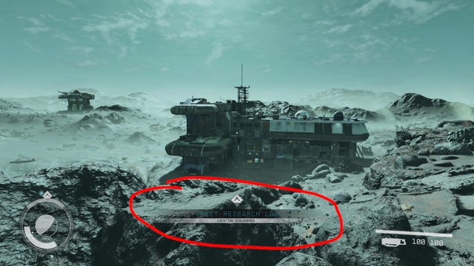 The rocky landscape of Kreet in Starfield with a Research Lab in the background. A red circle highlights the Research Lab discovery UI element, which has been moved down to the bottom of the screen thanks to a mod.