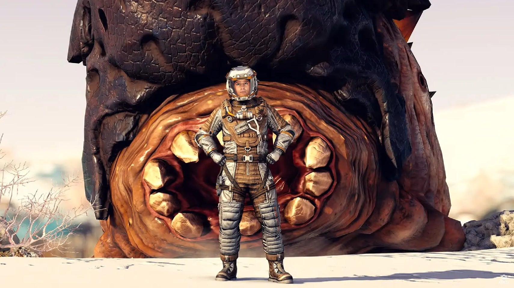 A screen grab of the photo mode in Starfield revealed during the Xbox Games Showcase 2023. A man stands proud in front of a felled beast with a huge, circular maw. - 1