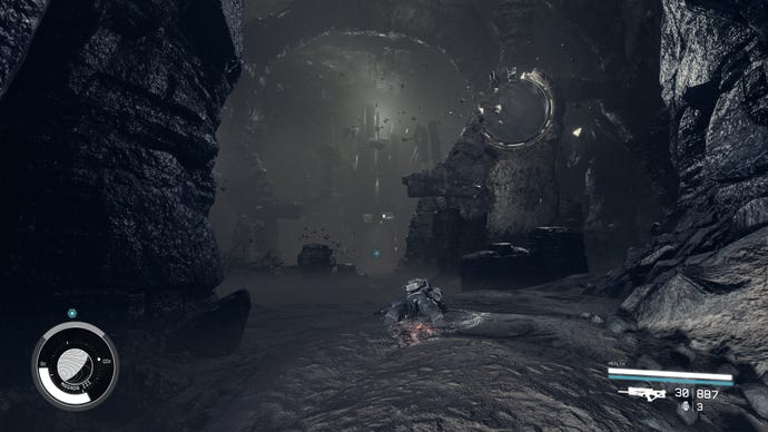 The large cavern of the last temple with a body on the floor, floating rocks, and glowing circles of rock in Starfield.