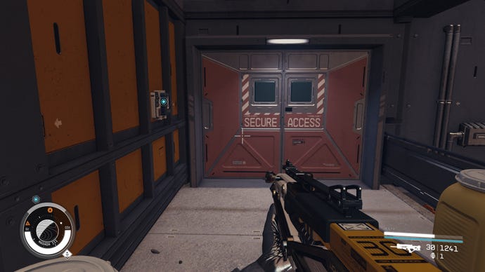 The red secure access door is locked with the blue locator highlighting where players should interact to gain entry in Starfield.