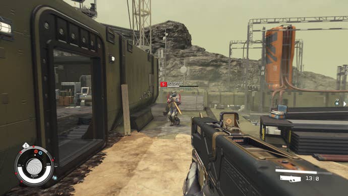 Shooting an enemy Eclipse soldier in an abandoned facility in Starfield