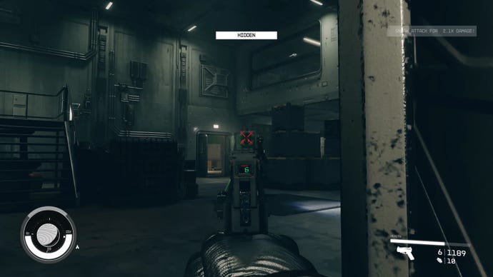 The player in Starfield headshot kills an enemy in a dark room with a pistol stealth attack.