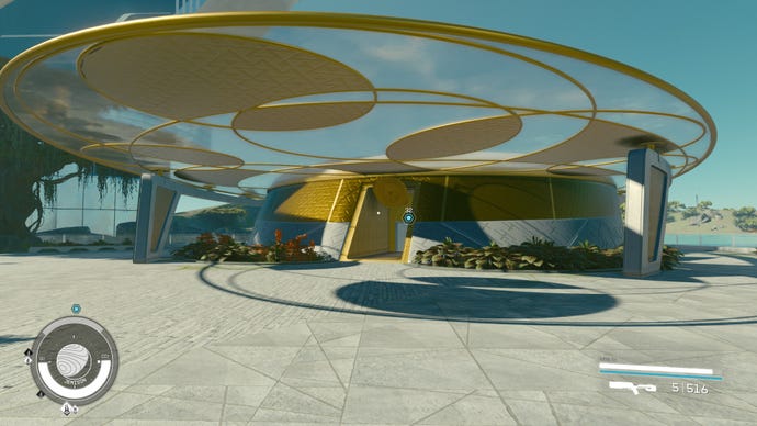 The circular gold building of the Sanctum Universum on Jemison in Starfield.