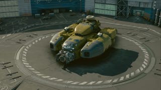starfield yellow and grey fighter ship on landing pad