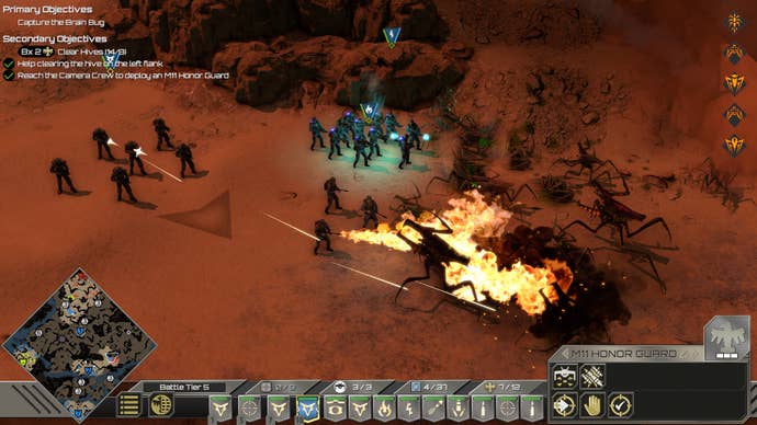 A group of marines in Starship Troopers: Terran Command firing on some attacking bugs