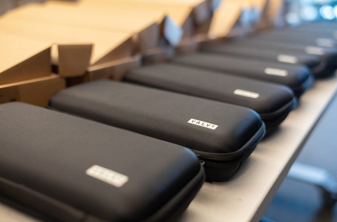 A row of carrying cases for Steam Deck dev kits, sat waiting to be packed into boxes.