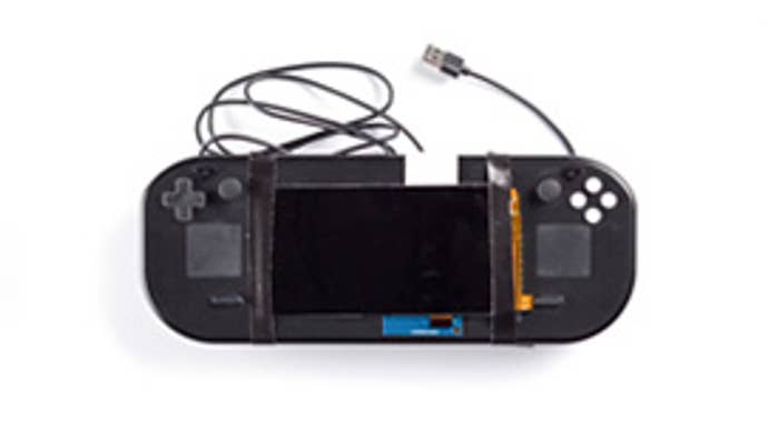 A Steam Deck prototype on a white background.