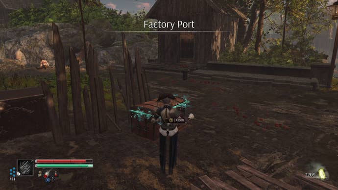 Aegis in Steelrising stands in front of a chest in the Factory Port area.