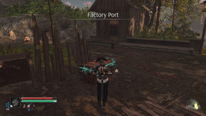 Aegis in Steelrising stands in front of a chest in the Factory Port area.