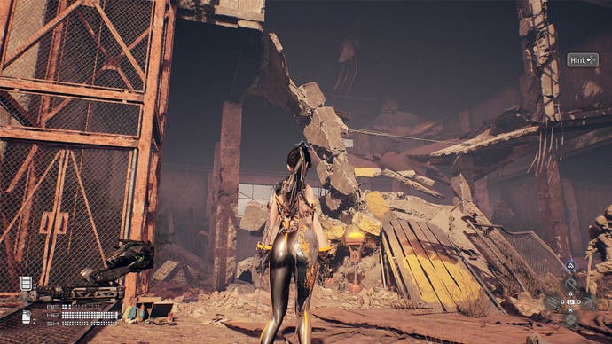 stellar blade eve facing entrance to crane id two building