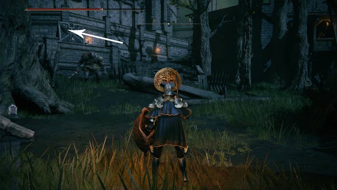 An ogre guarding the courtyard in Elden Ring’s Stormveil Castle.