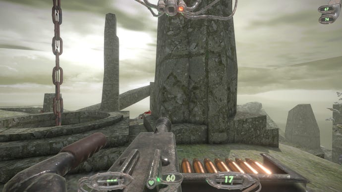 Aiming a large turret at a stone pillar.