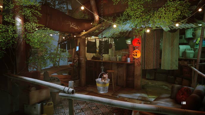 A cat sits in a bucket outside a RAM-en bar in Stray