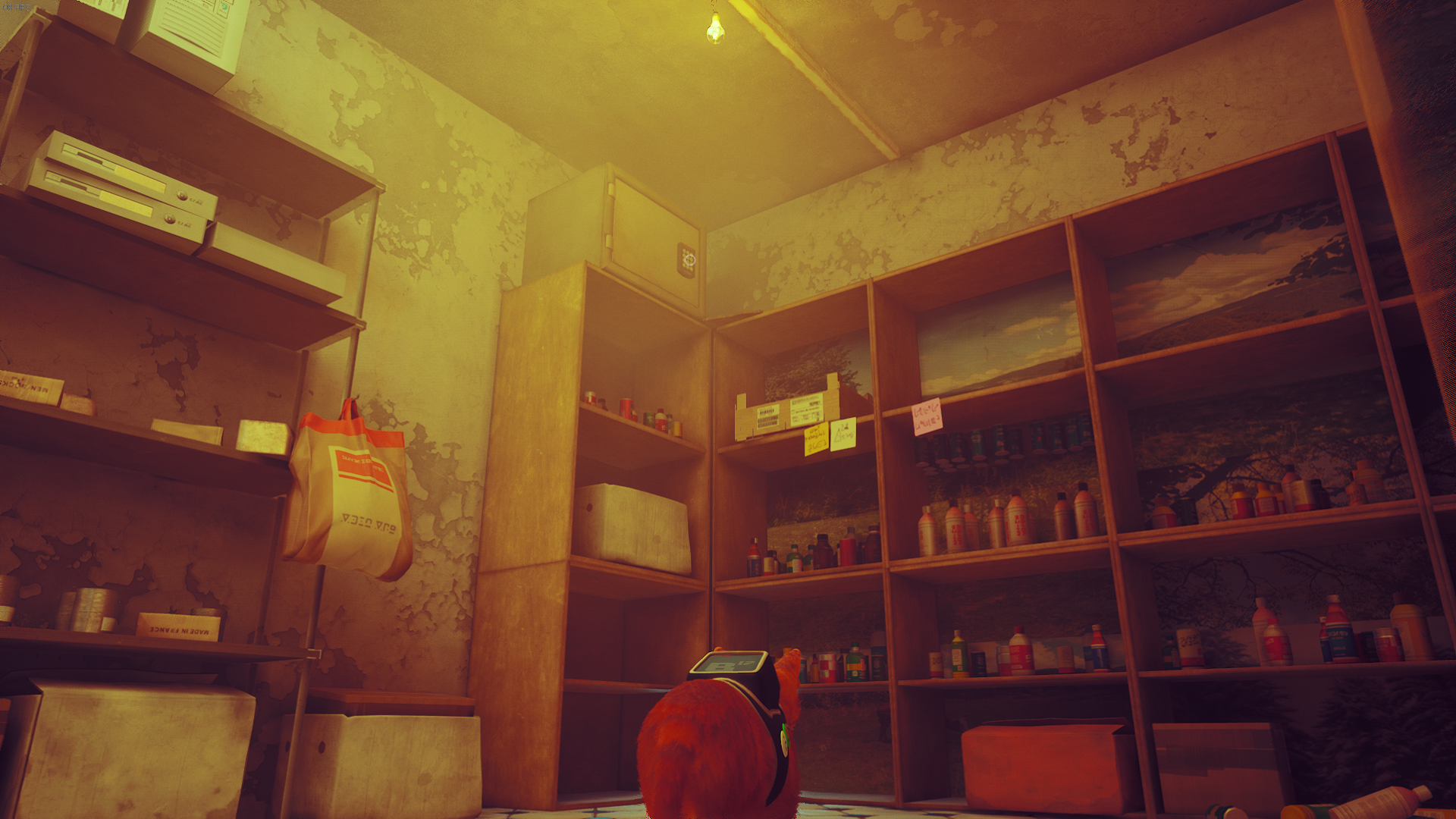 The cat of Stray looks up at a safe containing the cat badge in Midtown.