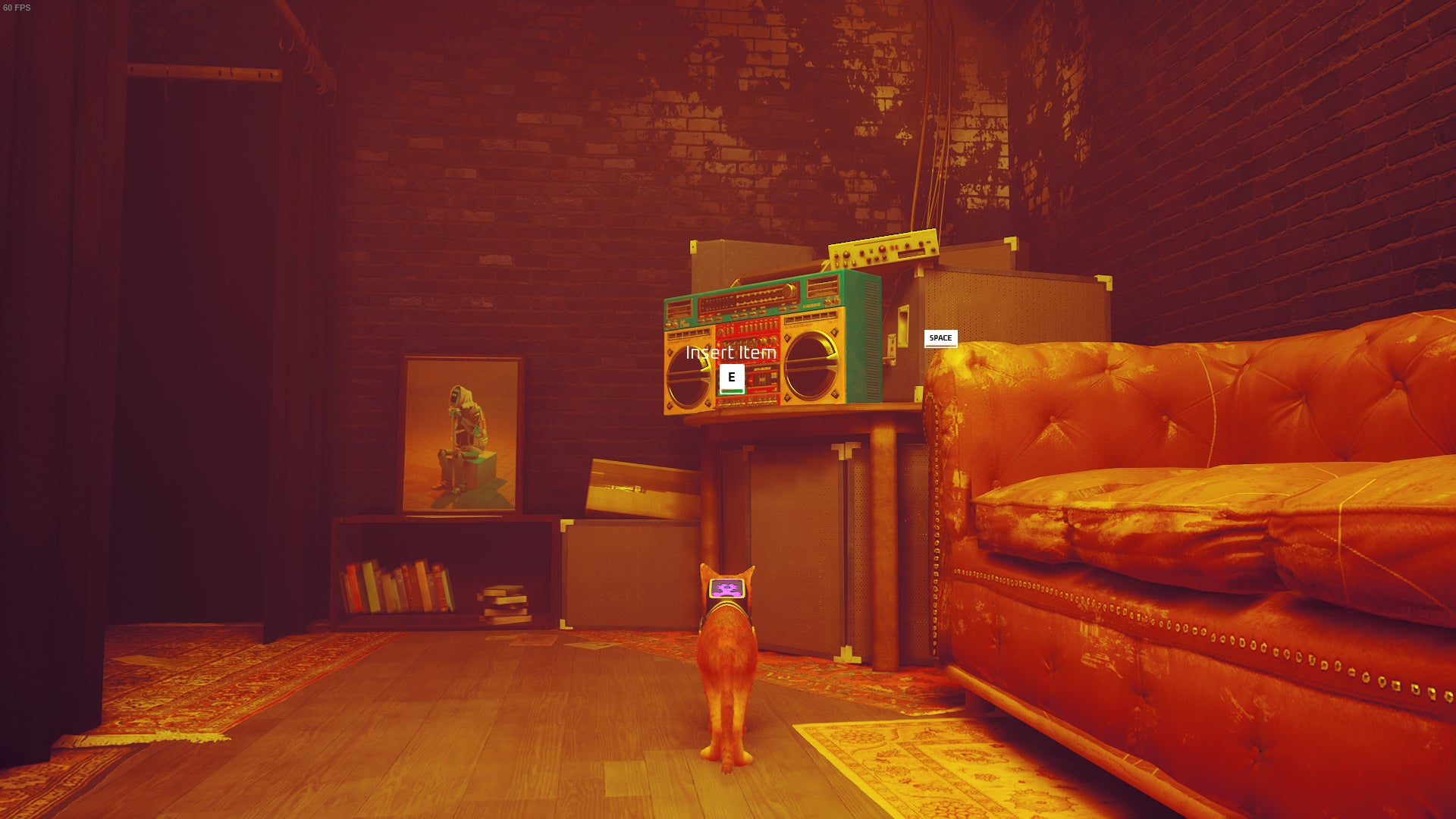 The cat of Stray looks at a cassette player that is in the changing rooms of the Midtown clothing store. - 10