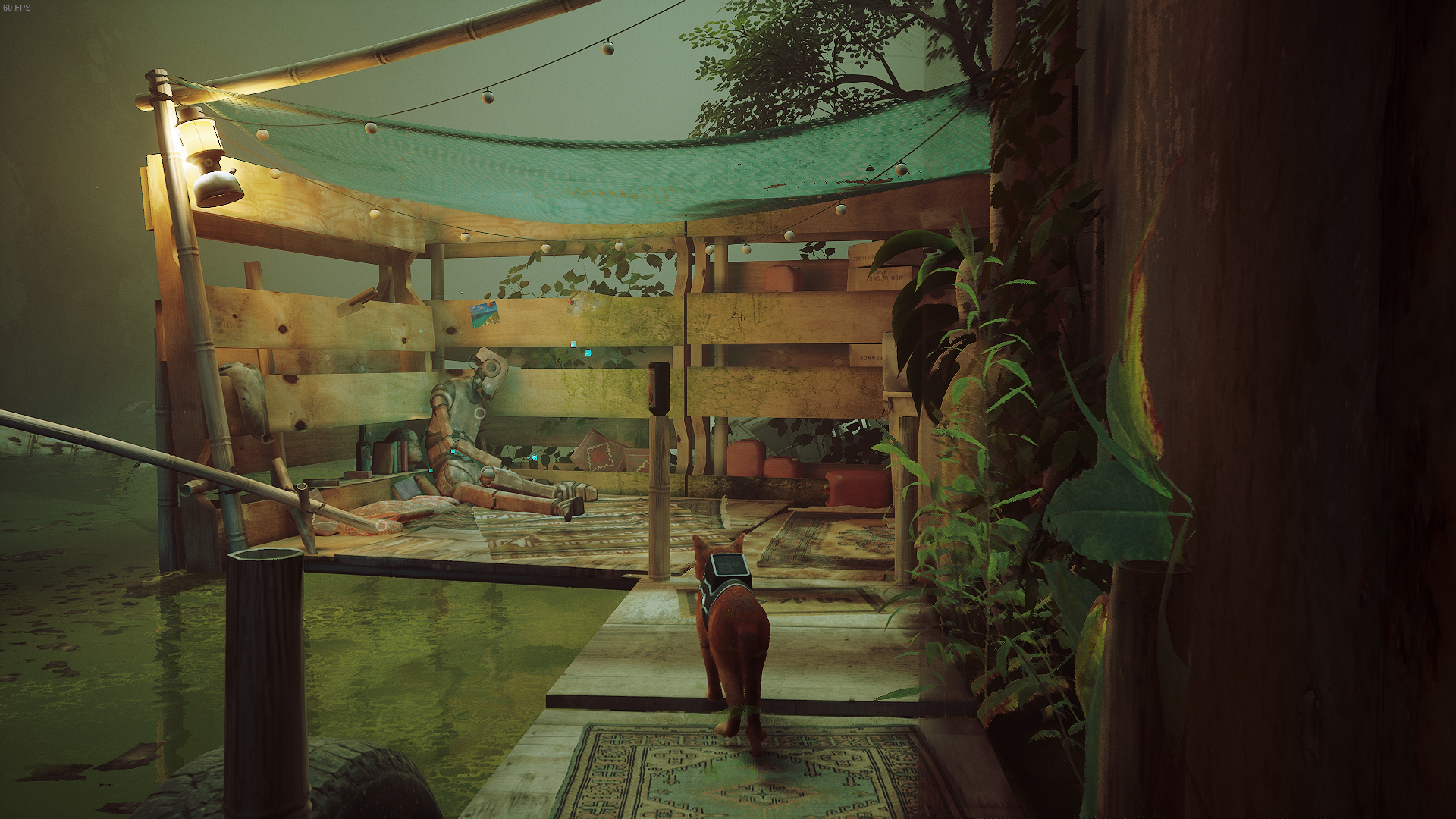 The cat of Stray looks at a deceased robot.